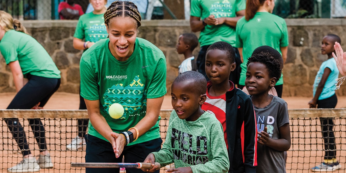 Vol Leader students playing with children