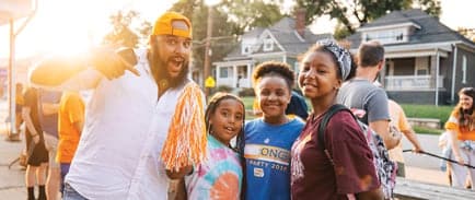 A UT Knoxville alum poses with his family at a chapter event