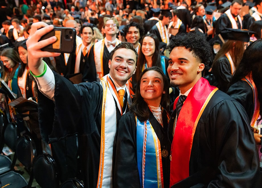 hero-ec-graduation Three graduates taking a selfie