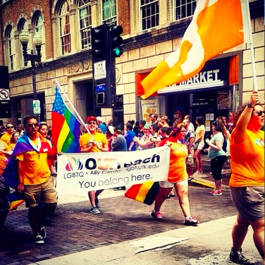 Representatives of the Pride Center march during a parade