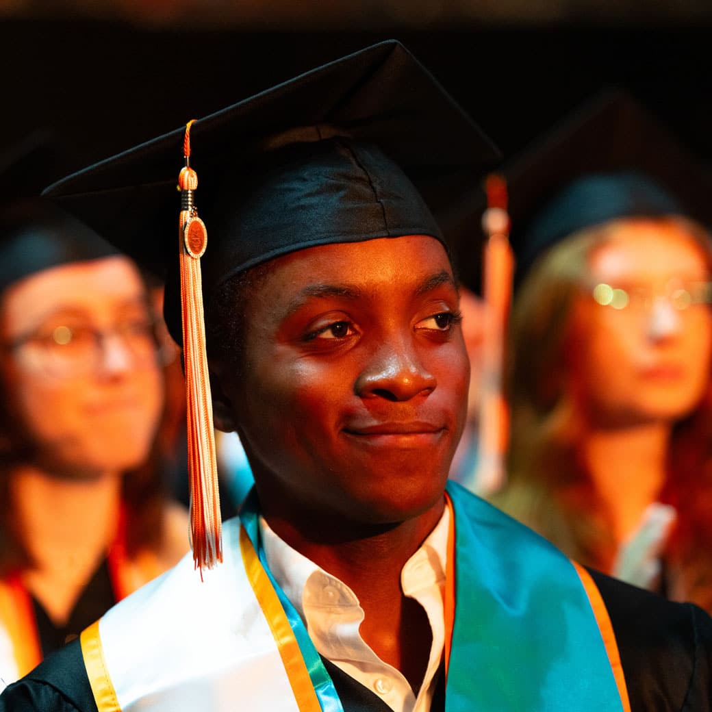 A graduate in a cap and gown