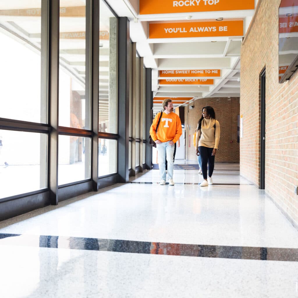 Two students walking in a hallway of the CCI building