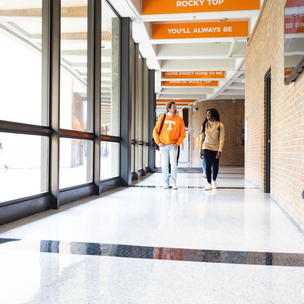 Two students walking in a hallway of the CCI building