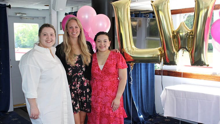 Three women posing for a photo