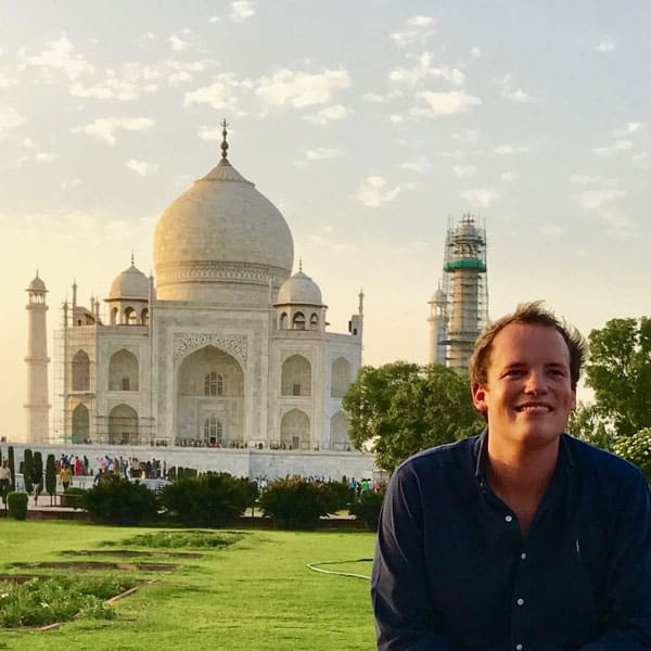 Zach Campbell with the Taj Mahal in the background