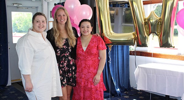 Three women posing for a photo