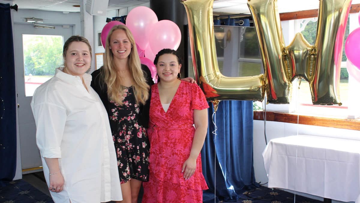 Three women posing for a photo