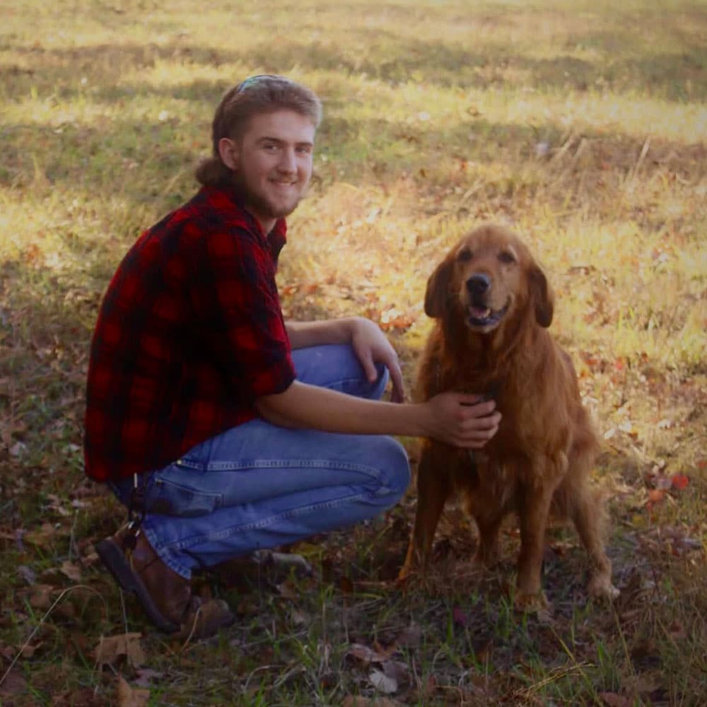 resnick-tyler Tyler Resnick with a golden retriever.