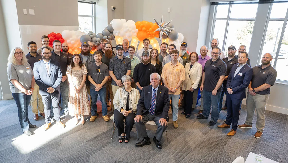 Debbie and John Grubb with a group of UT student veterans at a reception.