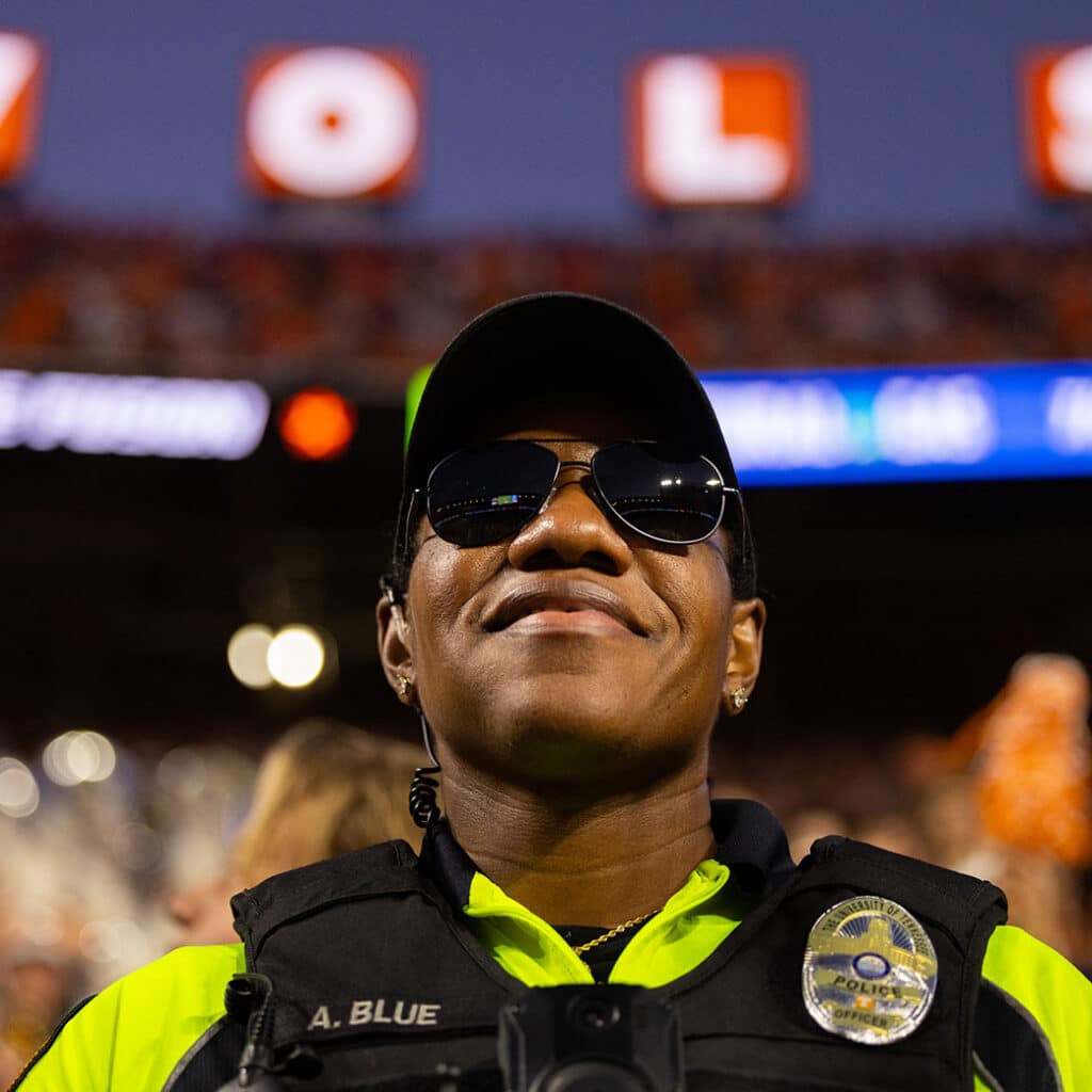 Ut police officer at football game smiling