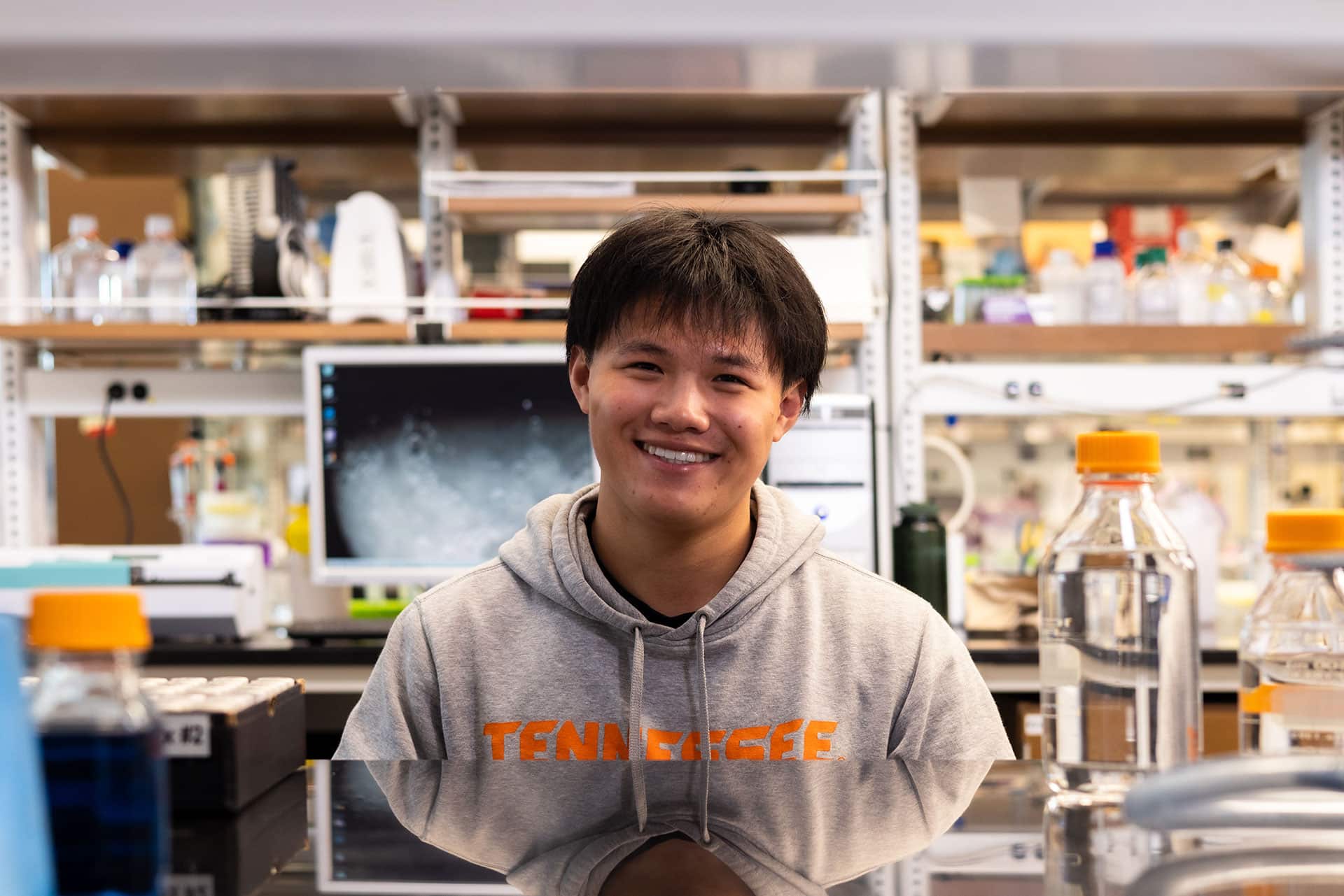 A person smiling and posing for a photo.