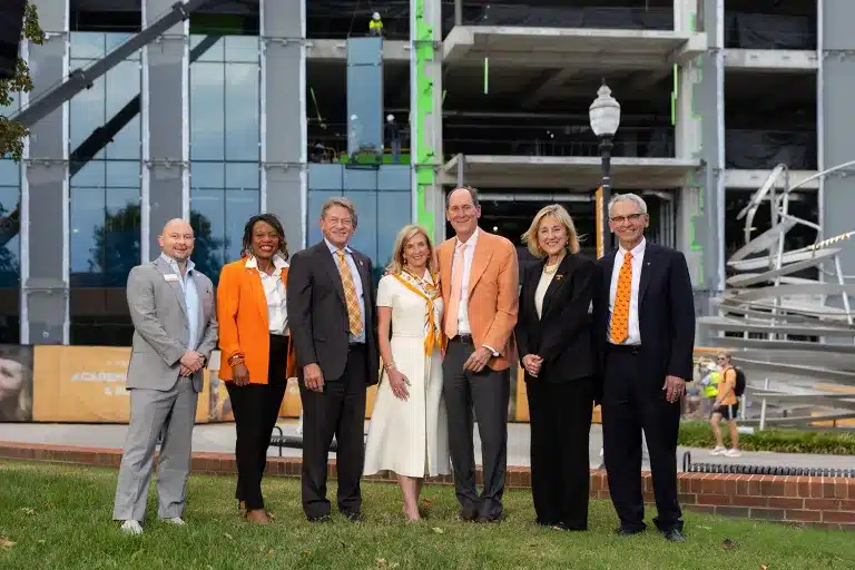 People standing in front of construction at University of Tennessee