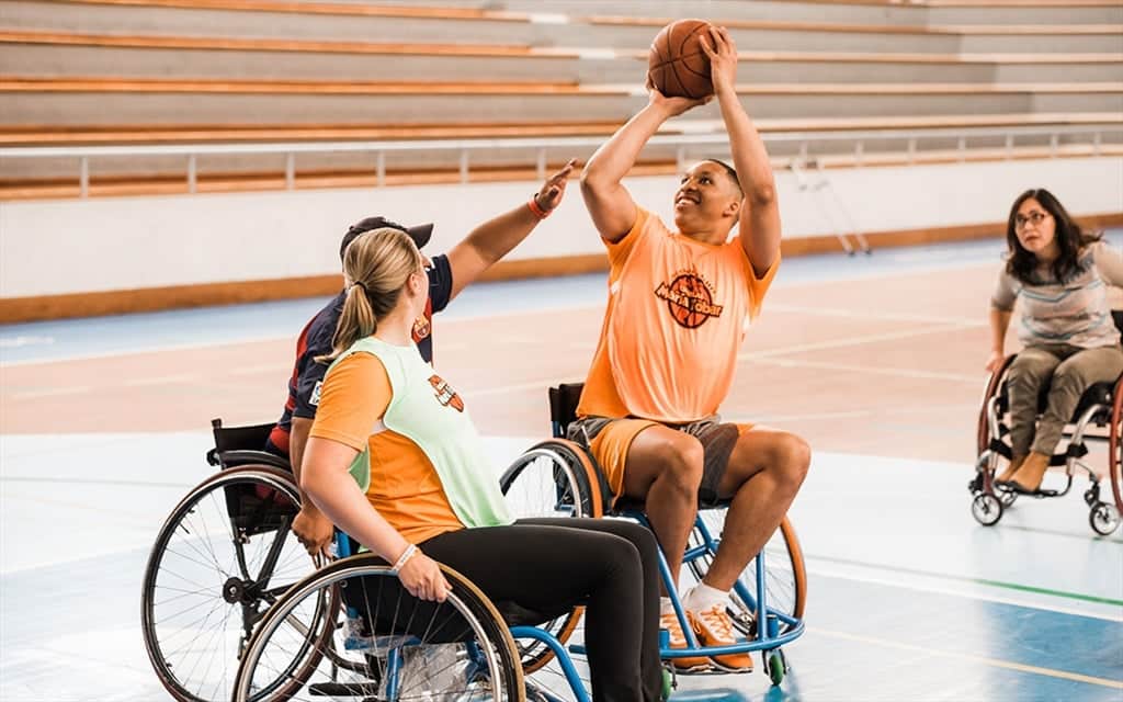 Grant Williams plays wheelchair basketball in Ecuador during a VOLeaders Academy trip