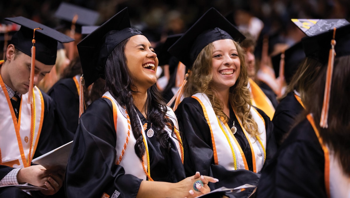 Students laugh during commencement