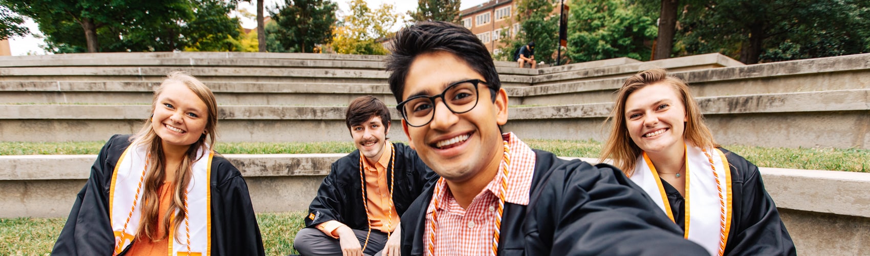 UT graduates smile for a selfie